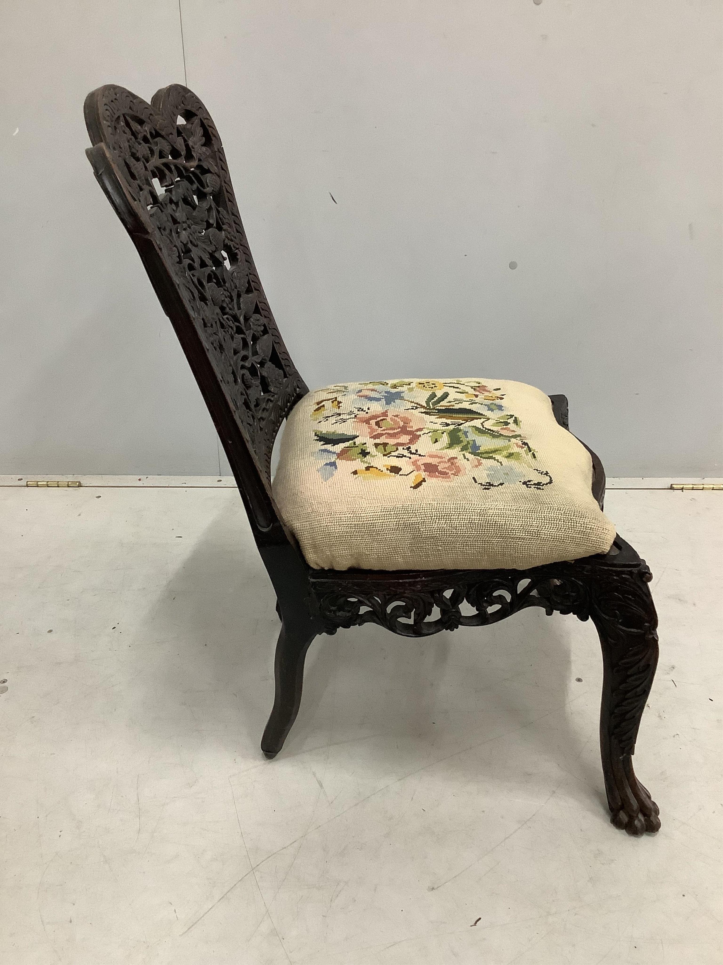 An Anglo Indian carved hardwood side chair with tapestry seat, height 81cm